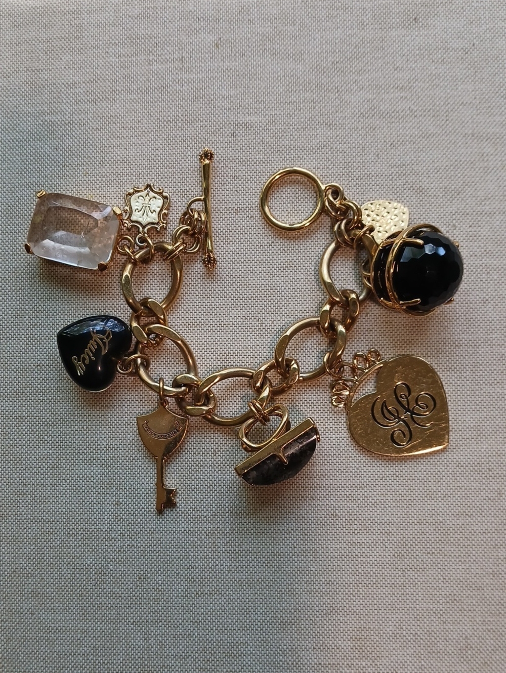 Gold-Tone Heart Charm Bracelet with Black and Clear Accents